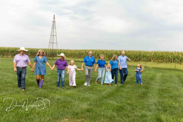 Ferguson family walking hand in hand past a windmill Ferguson family walking hand in hand past a windmill