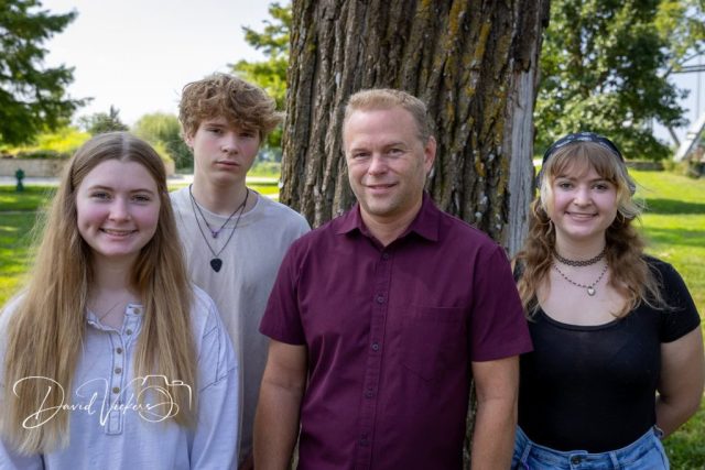 Father with his three teenagers at a Kansas City family session Father with his three teenagers at a Kansas City family session